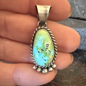 Sterling silver Sonoran Mountain pendant by Navajo artist M. Spencer